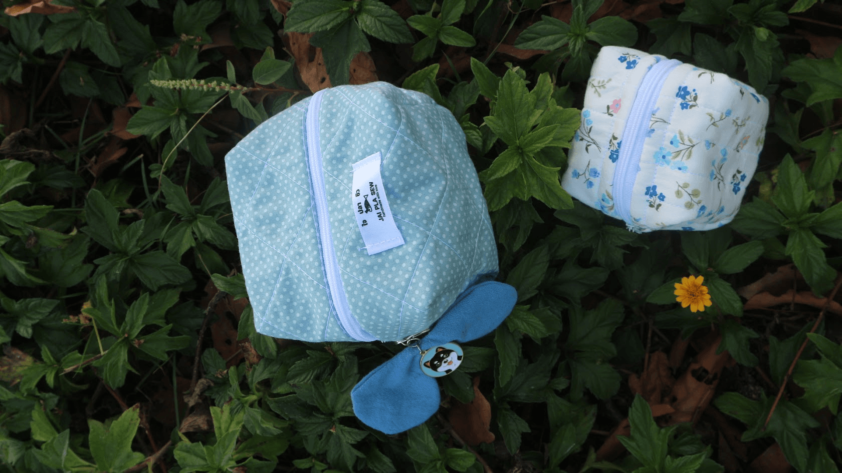 Stack of cozy knitted blankets in soft pastel tones